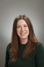 Portrait of Marissa Walinga wearing a dark green sweater. 