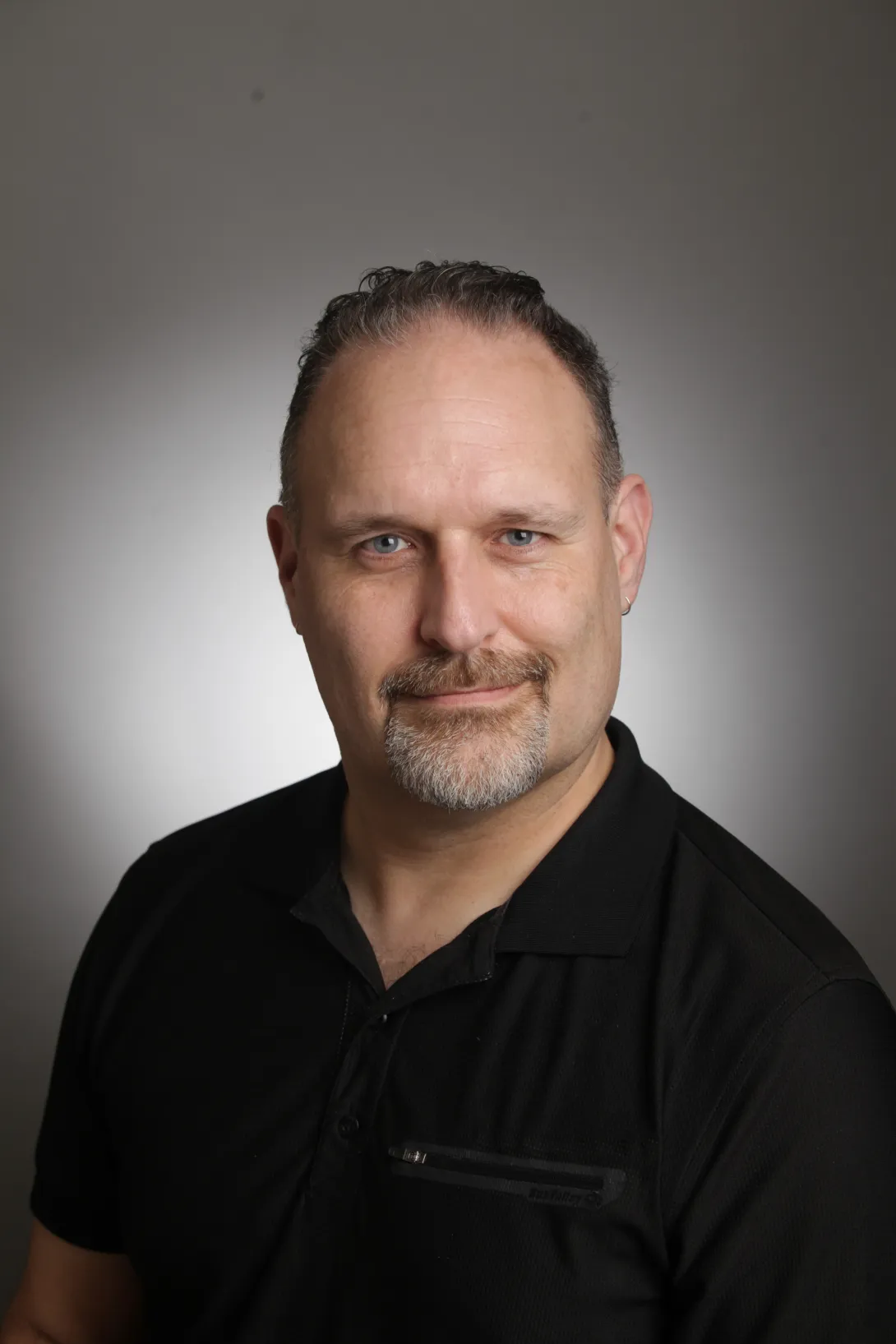 Portrait of Dan Scott in a black shirt